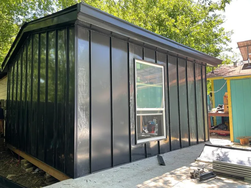 Black standing seam metal wall panels for Roof Inspection in Homer