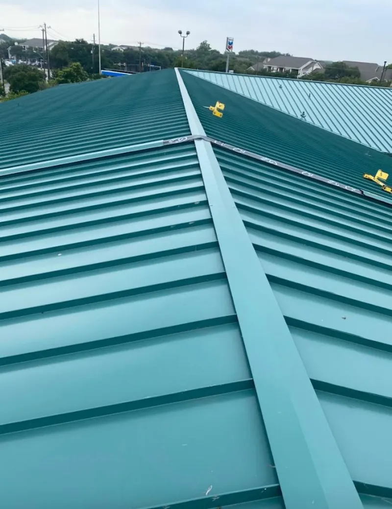 Green commercial metal roof ridge and valley for Metal Roof Repair in Homer